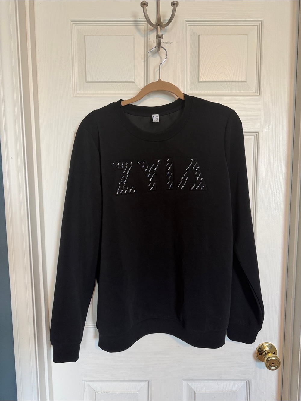 ZYIA Black Crewneck Sweatshirt with Studded Logo